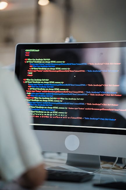 A computer screen displaying HTML code with multiple lines of markup, including elements such as '<head>', '<body>', and '<div>' tags. The code is color-coded with syntax highlighting, featuring blue,